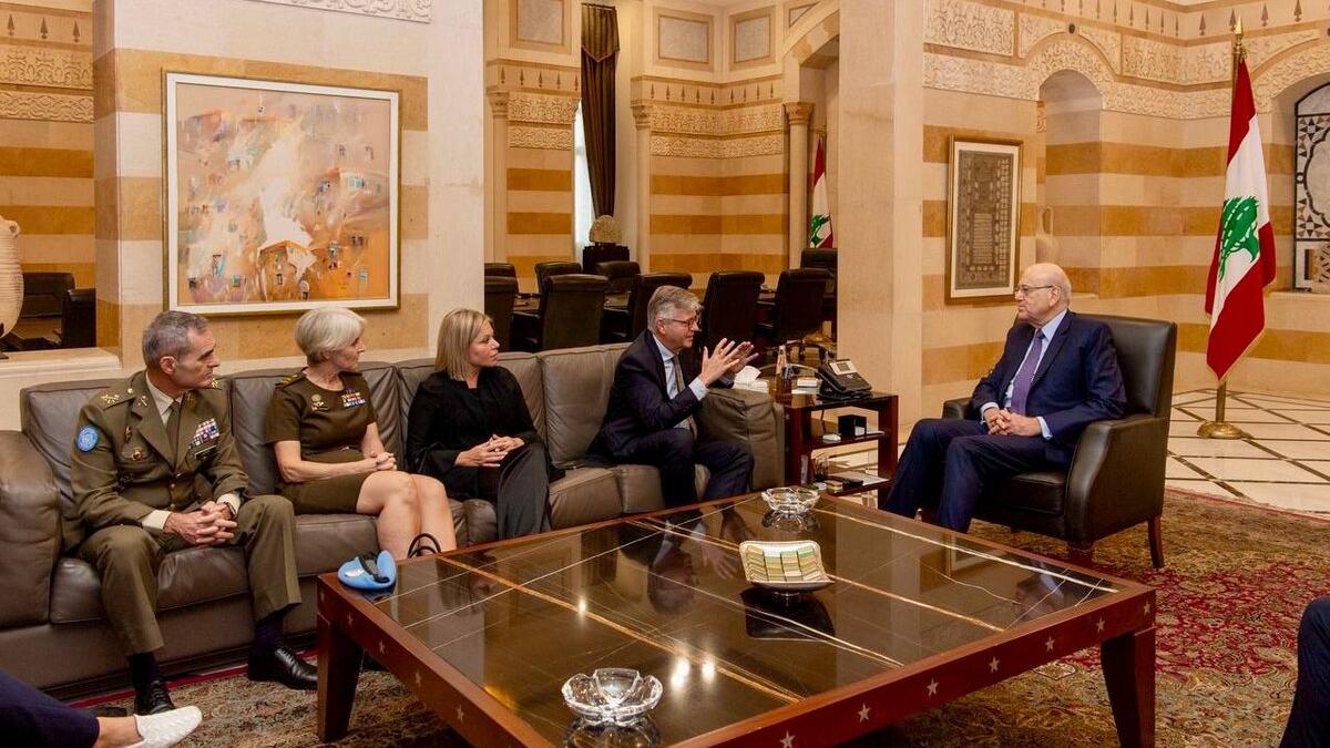 High level representatives attend a meeting.