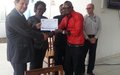 ERSG award certificates to the Artists for Peace for their role in ensuring peaceful 2012 elections